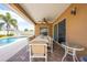Outdoor patio with ceiling fan, dining table, and access to the backyard pool area at 3101 Drema Dr, St Cloud, FL 34769