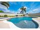 Sparkling pool and spa surrounded by a patio, perfect for outdoor entertaining at 3101 Drema Dr, St Cloud, FL 34769