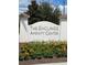The Enclaves Amenity Center sign surrounded by colorful flowers and lush green landscaping at 313 Captiva Dr, Davenport, FL 33896