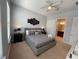 This bedroom boasts natural light, neutral colors, and an ensuite bathroom at 313 Captiva Dr, Davenport, FL 33896