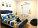 Playful bedroom with Minion-themed decor, fun decals, and cozy beanbag at 313 Captiva Dr, Davenport, FL 33896