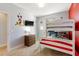 Vibrant bedroom with bunk beds, a playful design, and a TV at 313 Captiva Dr, Davenport, FL 33896