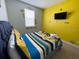 Bedroom with Minion decorations and a flat screen television at 313 Captiva Dr, Davenport, FL 33896
