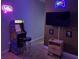 Game room with a vintage arcade game, mounted flat screen tv, and modern console-themed lighting at 313 Captiva Dr, Davenport, FL 33896
