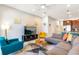 Bright living room with neutral tones, comfortable seating, and a modern entertainment center at 313 Captiva Dr, Davenport, FL 33896