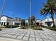 Attractive town center with storefronts, lush landscaping, and a beautifully paved walkway at 313 Captiva Dr, Davenport, FL 33896