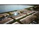 Aerial view of lakeside community with carports and well-maintained landscaping next to the lake at 344 Winter Ridge Blvd # 344, Winter Haven, FL 33881