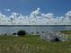 Beautiful backyard lake view, deck, and lush green grass at 344 Winter Ridge Blvd # 344, Winter Haven, FL 33881
