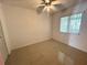 Bedroom featuring tile flooring, ceiling fan and natural light from a window at 344 Winter Ridge Blvd # 344, Winter Haven, FL 33881