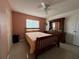 Cozy bedroom featuring tile flooring, a ceiling fan, and ample natural light at 344 Winter Ridge Blvd # 344, Winter Haven, FL 33881