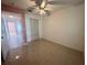 Bedroom featuring tile flooring and closet for storing personal items at 344 Winter Ridge Blvd # 344, Winter Haven, FL 33881