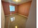 Bedroom features neutral tile flooring with a window for natural light at 344 Winter Ridge Blvd # 344, Winter Haven, FL 33881