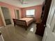 Comfortable bedroom with tile floors, closet, and ample natural light at 344 Winter Ridge Blvd # 344, Winter Haven, FL 33881