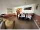 View of the dining room with space for six and open layout into the kitchen at 344 Winter Ridge Blvd # 344, Winter Haven, FL 33881