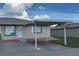 Single-story home with a convenient carport, stucco siding, and a brick parking area at 344 Winter Ridge Blvd # 344, Winter Haven, FL 33881