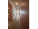 Hallway featuring neutral tile flooring leading to another room at 344 Winter Ridge Blvd # 344, Winter Haven, FL 33881