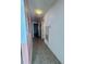 Hallway with tiled flooring that provides access to other rooms of the house at 344 Winter Ridge Blvd # 344, Winter Haven, FL 33881
