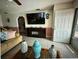 Inviting living room with tile flooring, a decorative fireplace and an open layout at 344 Winter Ridge Blvd # 344, Winter Haven, FL 33881
