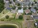 Wide aerial view showing the location of the house relative to community at 3638 Doe Run Dr, St Cloud, FL 34772