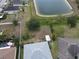 Aerial view highlighting large grassy backyard and location on neighborhood pond at 3638 Doe Run Dr, St Cloud, FL 34772