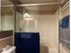 Shower stall with glass doors, overhead shower and bath fixtures at 3638 Doe Run Dr, St Cloud, FL 34772