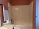 Bright bathroom features a clean, neutral-toned shower and essential fixtures at 3638 Doe Run Dr, St Cloud, FL 34772