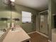 Well-lit bathroom with a glass-enclosed shower and neutral tones, featuring vanity and essential fixtures at 3638 Doe Run Dr, St Cloud, FL 34772