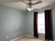 Bright bedroom with a ceiling fan, natural light, and soft carpet, creating a tranquil and inviting space at 3638 Doe Run Dr, St Cloud, FL 34772