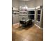 Cozy dining area with decor shelves and tile flooring, bathed in natural light from surrounding windows at 3638 Doe Run Dr, St Cloud, FL 34772