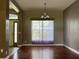 Dining room featuring hardwood floors and an elegant chandelier at 3638 Doe Run Dr, St Cloud, FL 34772