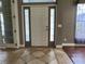 Welcoming foyer with tile flooring and natural light at 3638 Doe Run Dr, St Cloud, FL 34772