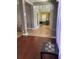 View of the foyer featuring tile flooring, wooden accents, and an entryway to the home office at 3638 Doe Run Dr, St Cloud, FL 34772