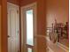 Hallway with clean white doors and decoratively painted walls at 3638 Doe Run Dr, St Cloud, FL 34772