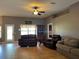 Comfortable living room with tile flooring and ample natural light at 3638 Doe Run Dr, St Cloud, FL 34772