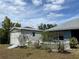 Backyard shed with a ramp and tidy garden space with a partial home view on a sunny day at 3638 Doe Run Dr, St Cloud, FL 34772