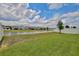 Expansive backyard overlooks a serene pond, with ample space for outdoor enjoyment at 4327 Silver Creek St, Kissimmee, FL 34744