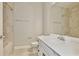 Bathroom featuring a single vanity, toilet and tiled shower at 4327 Silver Creek St, Kissimmee, FL 34744