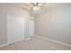 Spacious bedroom with a ceiling fan and double door closet at 4327 Silver Creek St, Kissimmee, FL 34744