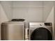 Laundry room equipped with modern, stainless steel washing machine and dryer at 4327 Silver Creek St, Kissimmee, FL 34744