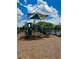 Community playground with slides and climbing structures next to the community pool on a beautiful day at 4327 Silver Creek St, Kissimmee, FL 34744