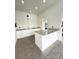Community poolside kitchen with granite countertops, white cabinets, sink and pass-through window at 4327 Silver Creek St, Kissimmee, FL 34744