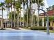 Community basketball court surrounded by palm trees and lush landscaping at 4722 Flagler Beach Way, Kissimmee, FL 34746
