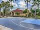 Community basketball court with lush greenery and mature palm trees in the background at 4722 Flagler Beach Way, Kissimmee, FL 34746
