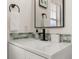 Stylish bathroom detail with a black faucet, backsplash and decorative accents at 4722 Flagler Beach Way, Kissimmee, FL 34746