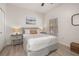Cozy bedroom with natural light, bedside lamps, and neutral decor at 4722 Flagler Beach Way, Kissimmee, FL 34746