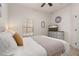 Spacious bedroom with ceiling fan, natural light, and modern decor at 4722 Flagler Beach Way, Kissimmee, FL 34746