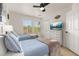 Bright bedroom with two twin beds, a dresser with TV, and closet at 4722 Flagler Beach Way, Kissimmee, FL 34746