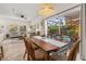 Open concept dining area with views of the living room and lanai with swimming pool at 4722 Flagler Beach Way, Kissimmee, FL 34746