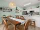 Cozy dining area with wooden table set, perfect for Gathering meals and entertaining guests at 4722 Flagler Beach Way, Kissimmee, FL 34746