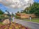 Terra Verde community entrance with stone sign, lush landscaping, and decorative lampposts at 4722 Flagler Beach Way, Kissimmee, FL 34746